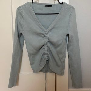Sweater with adjustable ruche front